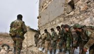 Syrian pro-government troops hold a position in Aleppo's eastern Karm al-Jabal neighborhood as they advance towards al-Shaar neighbourhood on December 5, 2016 during their offensive to retake Syria's second city ©GEORGE OURFALIAN (AFP)