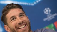 Real Madrid's defender Sergio Ramos smiles as he gives a press conference on the eve of the UEFA Champions league football match Real Madrid vs Borussia Dortmund at the Real Madrid's training ground of Valdebebas in Madrid on December 6, 2016. AFP / CURTO