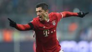 Bayern Munich's Polish striker Robert Lewandowski celebrates scoring the opening goal during the UEFA Champions League group D football match between FC Bayern Munich and Atletico Madrid in Munich, southern Germany, on December 6, 2016. / AFP / CHRISTOF S