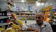 A worker goes about his day while waiting for customers at a supermarket in Cairo, Egypt, October 26, 2016. Picture taken October 26, 2016. REUTERS/Amr Abdallah Dalsh
