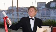 French, Polish born, director Roman Polanski posing for photographers after being awarded with the Golden Palm for his film 