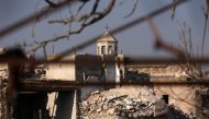 A part of a church is seen amid the damage in the government-controlled area of the Old City of Aleppo, Syria December 10, 2016. REUTERS/Omar Sanadiki