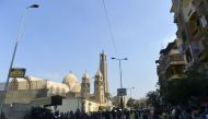 Egyptian security forces gather at the site of an explosion at the Saint Mark's Coptic Orthodox Cathedral on December 11, 2016 in the Abbasiya neighbourhood in the capital Cairo. Copts, who make up about 10 percent of Egypt's population of 90 million, hav