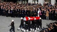 Turkish police officers carry a coffin of a fellow officer during a ceremony for police officers killed in Saturday's blasts in Istanbul, Turkey, December 11, 2016. REUTERS/Murad Sezer
