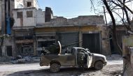 Syrian pro-government forces patrol Aleppo's Bab al-Nairab neighbourhood on December 10, 2016. Syria's government has retaken at least 85 percent of east Aleppo, which fell to rebels in 2012, since beginning its operation on November 15. / AFP / George OU