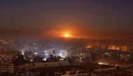 Smoke and flames rise after air strikes on rebel-controlled besieged area of Aleppo, as seen from a government-held side, in Syria December 11, 2016. REUTERS/Omar Sanadiki TPX IMAGES OF THE DAY.
