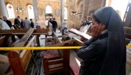 A nun cries as she stands at the scene inside Cairo's Coptic cathedral, following a bombing, in Egypt December 11, 2016. REUTERS/Amr Abdallah Dalsh