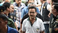 FILE PHOTO: Suspect in Thailands recent bomb attacks is escorted to the Crime Suppression Division in Bangkok on August 19, 2016 (AFP)