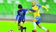 Al Sailiya's Sayaf Mohsin and Al Gharafa's Vadimir Weiss vie for ball possession during their QSLmatch at Al Ahli Stadium yesterday.