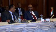 Sudanese President Omar al-Bashir (R) and Sudanese foreign minister Ibrahim Ghandour (L) attend the 29th Intergovernmental Authority on Development (IGAD) summit in Addis Ababa, Ethiopia on December 09, 2016. ( Minasse Wondimu Hailu - Anadolu Agency )
