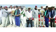 Qatar Cricket Association officials giving away the trophy to the wining captain.