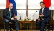 Japanese Prime Minister Shinzo Abe gestures while speaking to Russian President Vladimir Putin during their meeting at a hot springs resort in Nagato, Japan, December 15, 2016. REUTERS/Alexander Zemlianichenko/Pool

