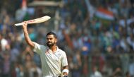 Virat Kohli greeting the crowd as he walks back towards the pavilion after his dismissal on the fourth day of the fourth Test cricket match between India and England at the Wankhede stadium in Mumbai. (AFP / PUNlT PARANJPE)