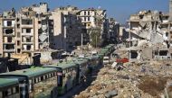 Buses are seen during an evacuation operation of rebel fighters and their families from rebel-held neighbourhoods in the embattled city of Aleppo on December 15, 2016. A convoy of ambulances and buses left rebel territory in Aleppo in the first evacuation