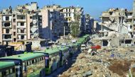 Buses are seen during an evacuation operation of rebel fighters and their families from rebel-held neighbourhoods in Aleppo yesterday.