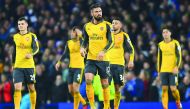 Arsenal's Olivier Giroud (centre) and team-mates react after Everton's Ashley Williams scored his teams's second goal during their Premier League match at Goodison Park Stadium in Liverpool, England on Tuesday.