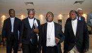 This file photo taken on November 12, 2016 shows delegates and members of Congolese Episcopal conference (Conference episcopale nationale du Congo, Cenco) arriving to meet United Nations Security Council's members in Kinshasa at the start of a three-day v