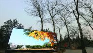 A screen is pictured in smog on a polluted day as a red alert issued for air pollution in Beijing, yesterday.