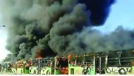 Buses are seen after they were attacked and burned in Idlib province while en route to evacuate ill and injured people from the besieged Syrian villages of Al Foua and Kefraya, yesterday.