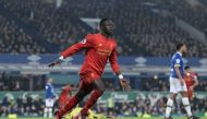 Liverpool's Senegalese midfielder Sadio Mane celebrates scoring his team's first goal during the English Premier League football match between Everton and Liverpool at Goodison Park in Liverpool, north west England on December 19, 2016.  AFP / Oli SCARFF 