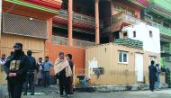 Afghan security officials at the site of Taliban attack in Kabul, yesterday.