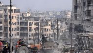Syrian troops cemented their hold on Aleppo after retaking full control of the city, as residents anxious to return to their homes moved through its ruined streets. AFP / George OURFALIAN