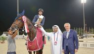 Victorious Ali Al Khorafi, astride  Cheril, receives his trophy.