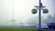 Heavy fog on the Corniche Road early yesterday morning. Pic: Abdul Basit/ The Peninsula