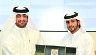 Qatar University and Qatar Olympic Academy officials after signing the agreement.