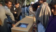 Pakistani Christians carry a coffin for one of the victims who was killed by toxic liquor on Christmas Eve in a Christian colony in Toba Tek Singh, some 338 kilometres (210 miles) south of Islamabad on December 27, 2016. AFP / STR