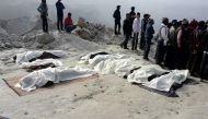 The covered bodies of trapped miners lie near the site of a coal mine collapse near Lalmatia in Godda district in eastern Jharkhand state on December 30, 2016. AFP / STRINGER

