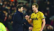 Tottenham Hotspur's coach Mauricio Pochettino (left) shakes hand with Harry Kane during their Premier League match against Southampton at St Mary's Stadium in Southampton, England on Wednesday.
