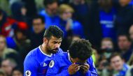 Chelsea's Willian (right) is consoled by Diego Costa after scoring a goal against Stoke City during their Premier League match at Stamford Bridge Stadium in London, in England yesterday.