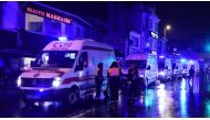 Ambulances are seen at the site of an armed attack on Jan. 1, 2017, in Istanbul. (YASIN AKGUL / AFP/Getty Images).