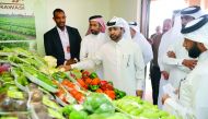 Dr Khalid bin Ibrahim Al Sulaiti, General Manager Katara (third left) with Salman Mohammad Al Naimi (second right), President of the committee of Mahaseel Festival at a stall after the opening of the festival at Katara, yesterday. Pic: Abdul Basit/The Pen