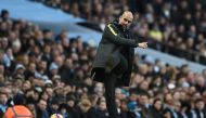 Manchester City's Spanish manager Pep Guardiola kicks the ball back onto the pitch during the English Premier League football match between Manchester City and Burnley at the Etihad Stadium in Manchester, north west England, on January 2, 2017. (AFP / Oli