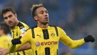 (FILES) This file photo taken on November 5, 2016 shows Pierre-Emerick Aubameyang from Dortmund celebrating his fourth goal during the German first division Bundesliga football match between Hamburg SV and BVB Borussia Dortmund in Hamburg.  AFP / CARMEN J