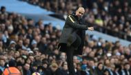 Manchester City's Spanish manager Pep Guardiola kicks the ball back onto the pitch during the English Premier League football match between Manchester City and Burnley at the Etihad Stadium in Manchester, north west England, on January 2, 2017. AFP / Oli 