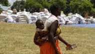 A Zimbabwean mother arrives to collect her monthly rations of food aid from Rutaura Primary School in the Rushinga district of Mt Darwin about 254km north of Harare March 7, 2013. REUTERS/Philimon Bulawayo