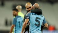Manchester City manager Pep Guardiola celebrates with Pablo Zabaleta after the game Action Images via Reuters / John Sibley