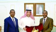 Djibouti's Minister of Labour and Administrative Reform Hassan Idriss Samrieh with a Qatar Chamber official.