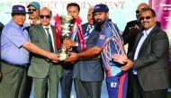 Galfar Al Misnad captain receiving the trophy after the final of QCA Tournament Division A title  at Asian Town Cricket Stadium in Doha recently.  