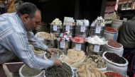A herbal store worker takes ingredients to prepare a natural herbal drug in Cairo, Egypt January 10, 2017. Picture taken January 10, 2017. REUTERS/Mohamed Abd El Ghany