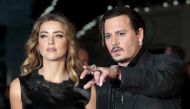 Johnny Depp and his actress wife Amber Heard arrive for the premiere of the British film ''Black Mass'' in London, Britain October 11, 2015. REUTERS/Suzanne Plunkett/
