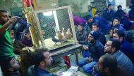 Auctioneer, Kadir Sakizci (left), at a pigeon auction in Sanliurfa, Turkey.