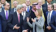 US Secretary of State John Kerry with European Union Foreign Policy Chief Federica Mogherini and other foreign ministers and representatives during the Mideast peace conference in Paris, France, yesterday.