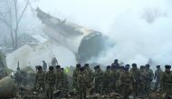 Rescue personnel work at the wreckage of a Turkish cargo plane after it crashed in the village of Dacha-Suu outside Bishkek, yesterday.