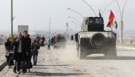 Civilians leave the city to escape from clashes during a battle with Islamic State militants, in al-Zirai district in Mosul, Iraq, January 18, 2017. REUTERS/Muhammad Hamed

