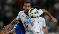  This file photo taken on May 17, 2013 shows Baniyas' Egyptian striker Mohamed Aboutrika controling the ball during their GCC Champions League first leg final football match against Al-Khor in Doha. Egyptian court has added former football star Mohamed Ab