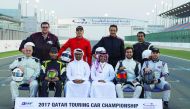 QMMF President, Abdulrahman Al Mannai and LCSC Vice President and General Manager, Khalid Al Remaihi pose for a photograph with riders after the practice session of the opening round of the Qatar Touring Car Championship (QTCC) yesterday.